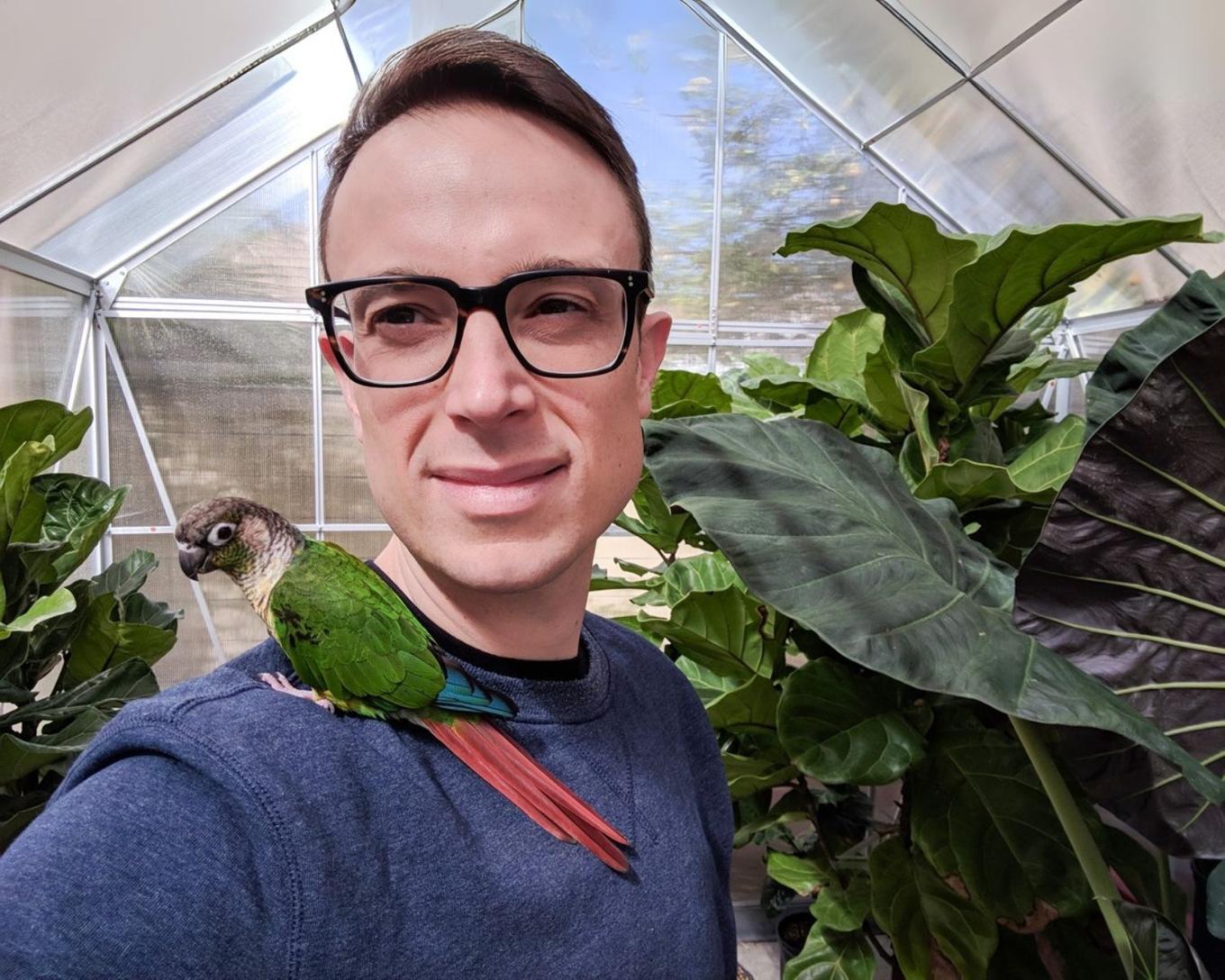 Co-founder Nicolas with George, the parrot